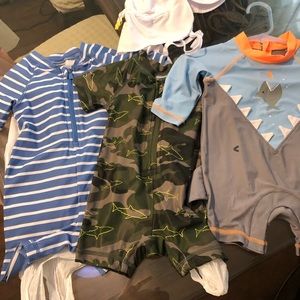 3   0-6 oldnavy swimsuits with a hat